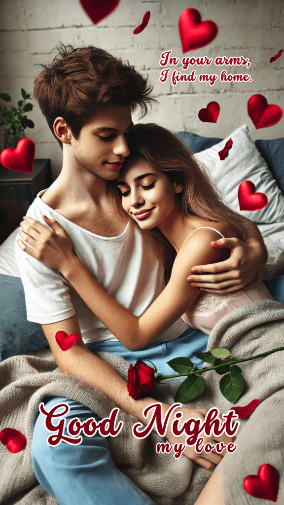 Romantic good night image featuring cozy moment between a young couple. The man lovingly embraces the woman, who is dressed in soft pink. Both are sitting together in a warmly lit bedroom.